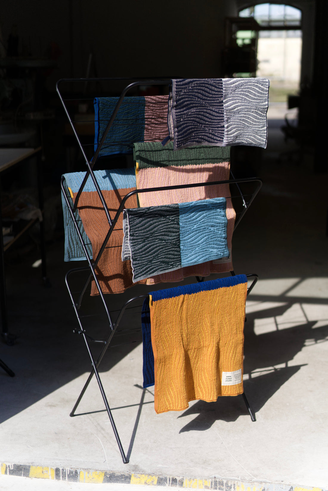 Hanging out to dry — Origami River Towels by towel.studio